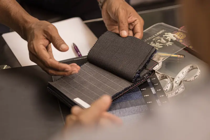 Owner at work at New David Jone Fashion, bespoke tailor in Phuket (Ref 6289)