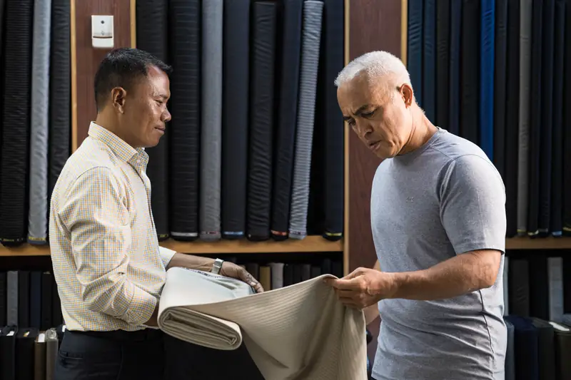 Hand-stitching buttonhole on a bespoke jacket, Phuket tailor (Ref 6318)