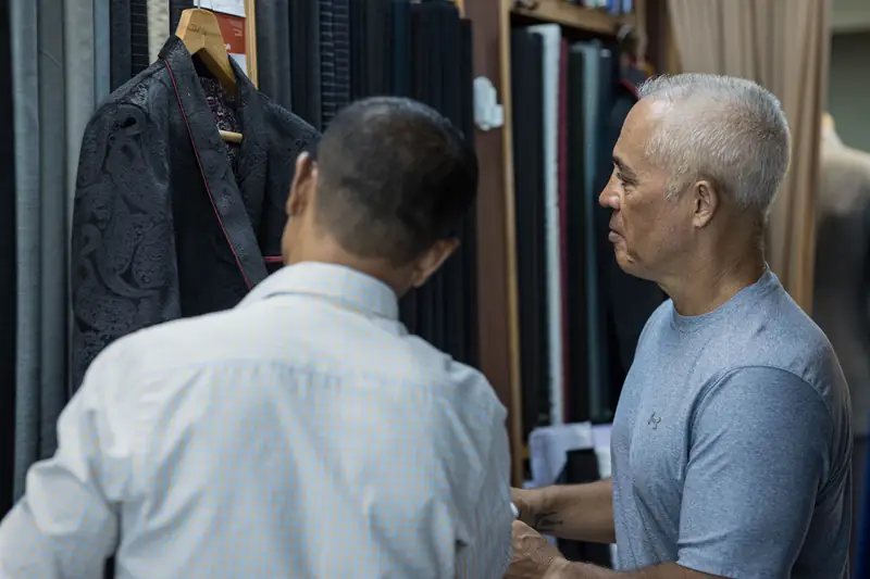 Stitching lining into a bespoke jacket at our Patong workshop (Ref 6327)