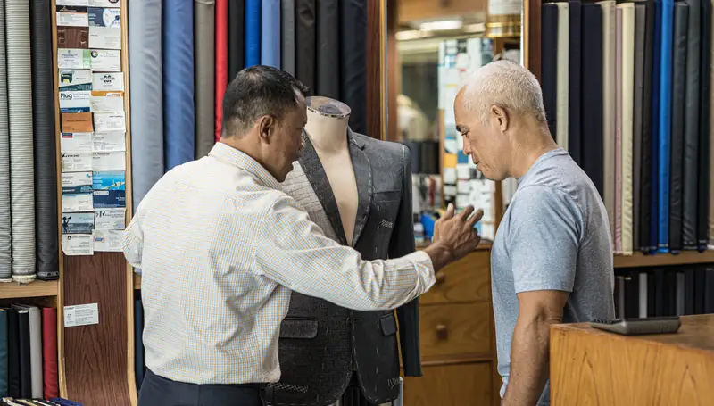 Pressing a bespoke jacket sleeve at David Jone Fashion, Phuket (Ref 6339)