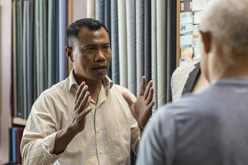 Tailor cutting cloth at David Jone Fashion workshop, Patong Phuket (Ref 6342)