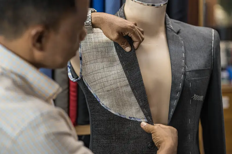 Tailor finishing lining on a custom suit, David Jone Fashion Patong (Ref 6353)