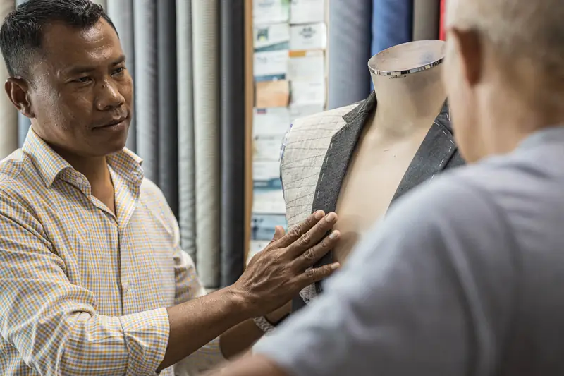 Hand-stitching buttonhole on a bespoke jacket, Phuket tailor (Ref 6354)