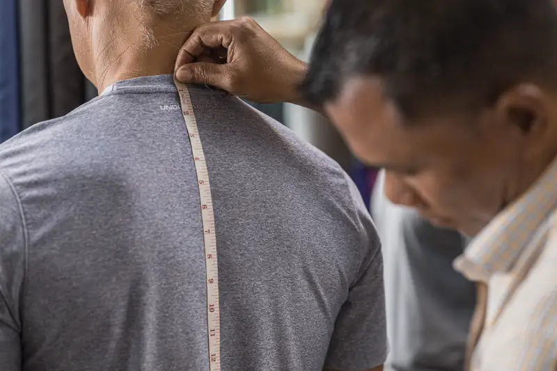 Pressing a bespoke jacket sleeve at David Jone Fashion, Phuket (Ref 6375)