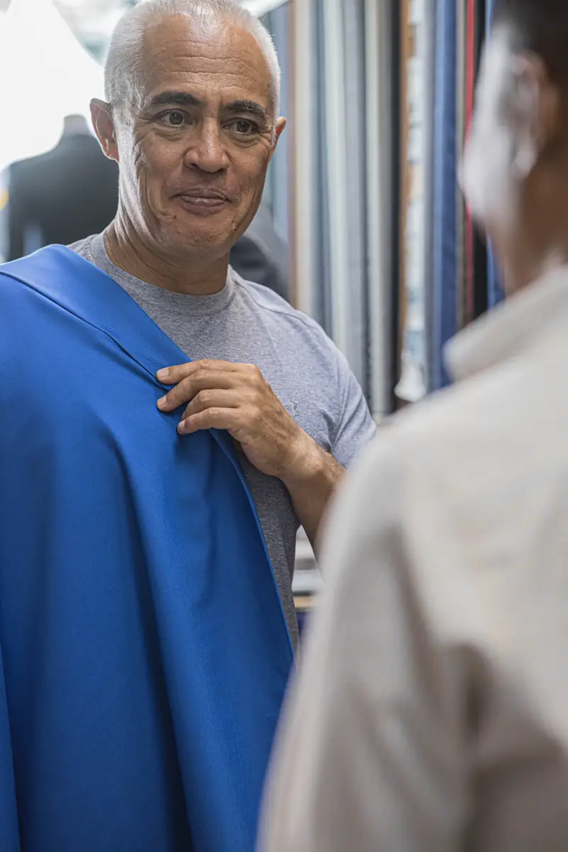 Tailor cutting cloth at David Jone Fashion workshop, Patong Phuket (Ref 6397)